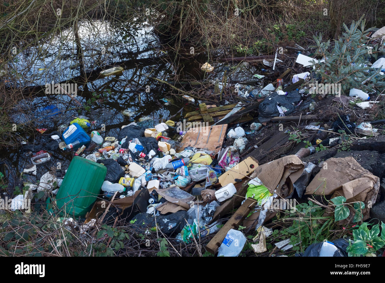 Fly tipping rubbish dumped in the countryside Stock Photo