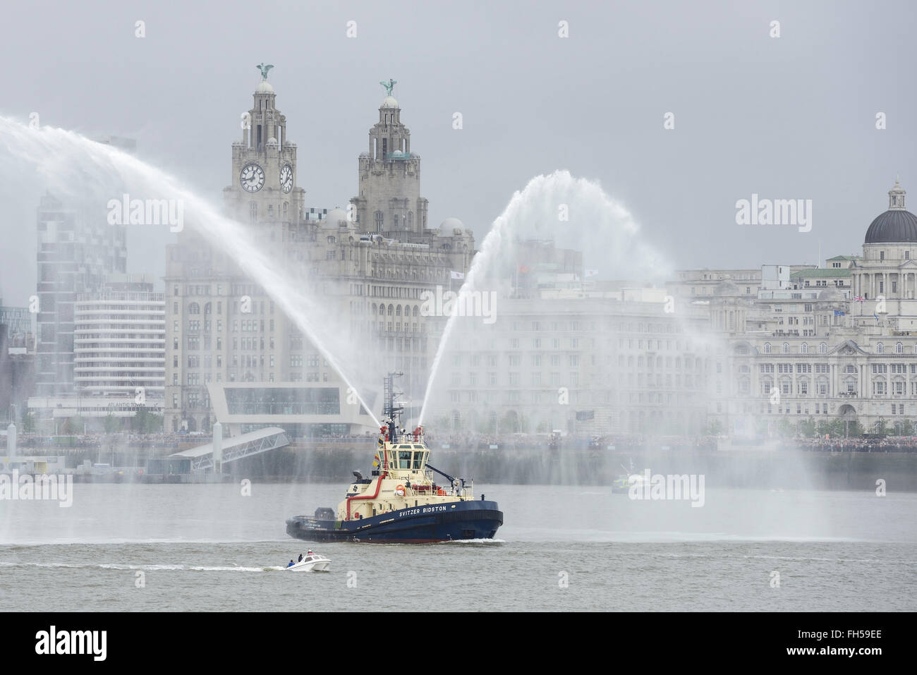 A fire boat in front of the Liver Building Liverpool UK Stock Photo