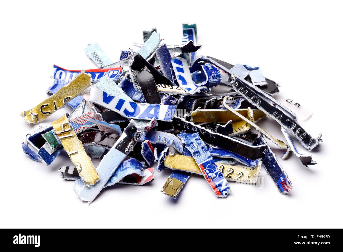 Bank credit cards and debit cards that have been security shredded Stock Photo