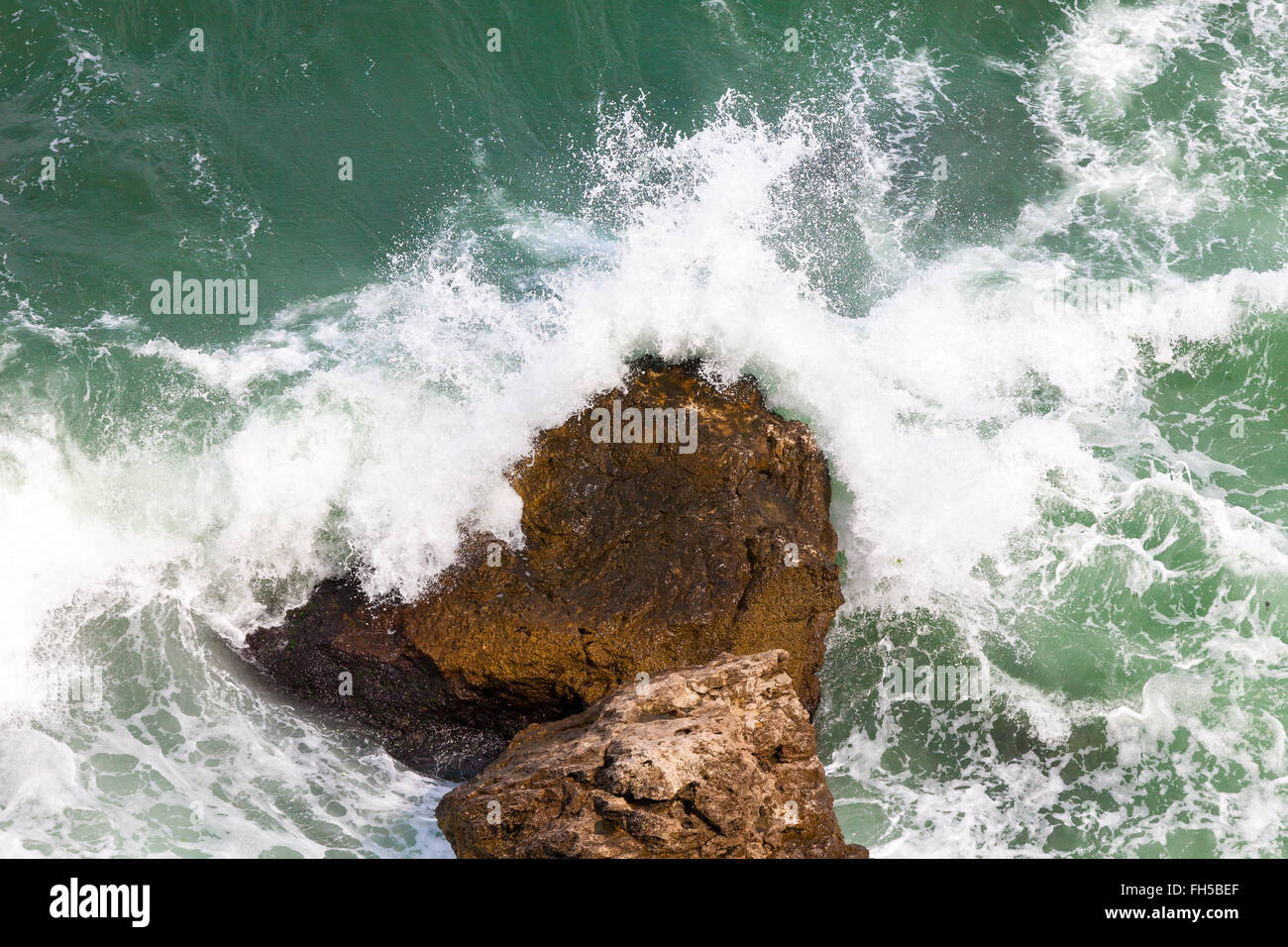 Rock and waves Stock Photo - Alamy