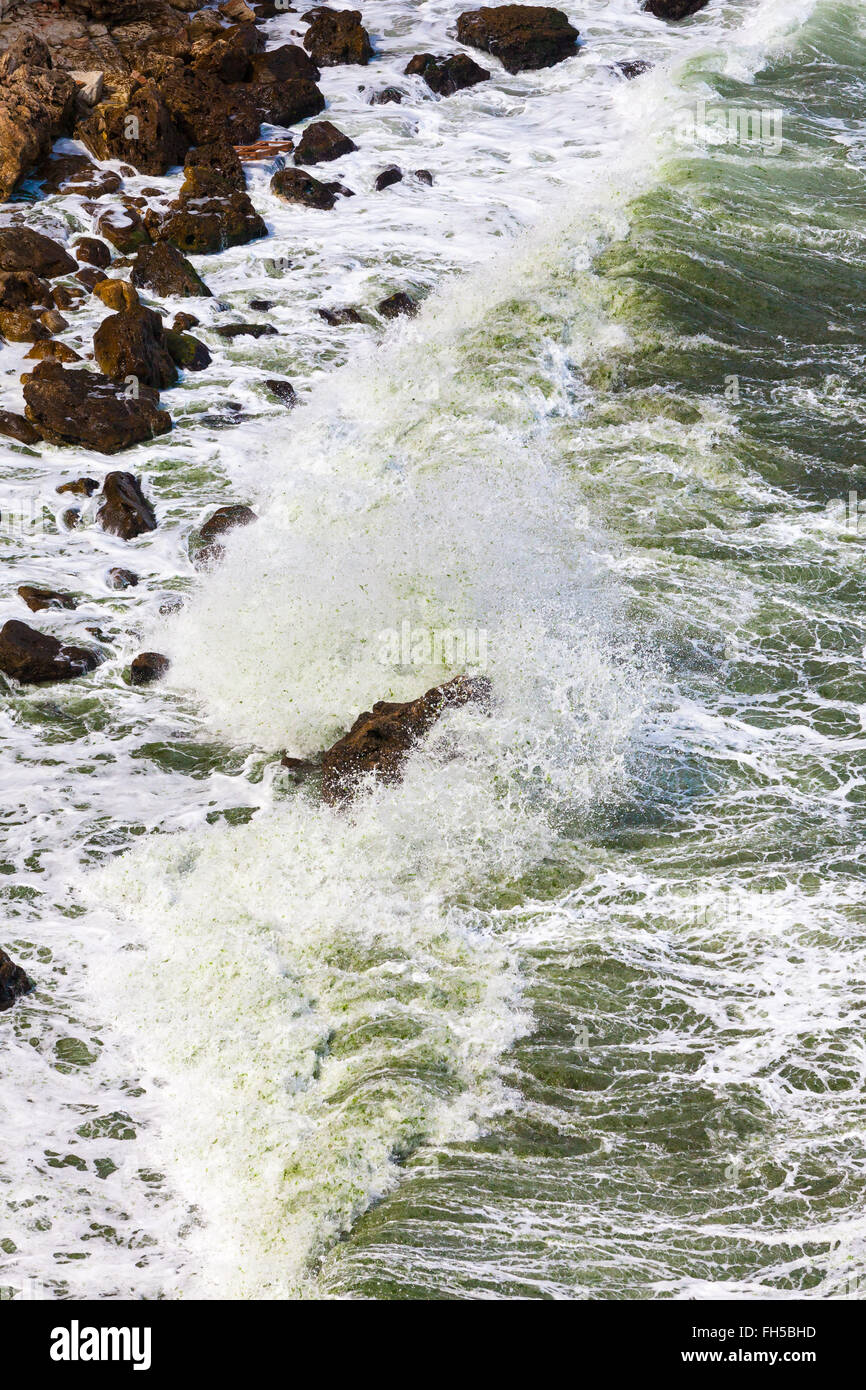 Rock and waves Stock Photo - Alamy