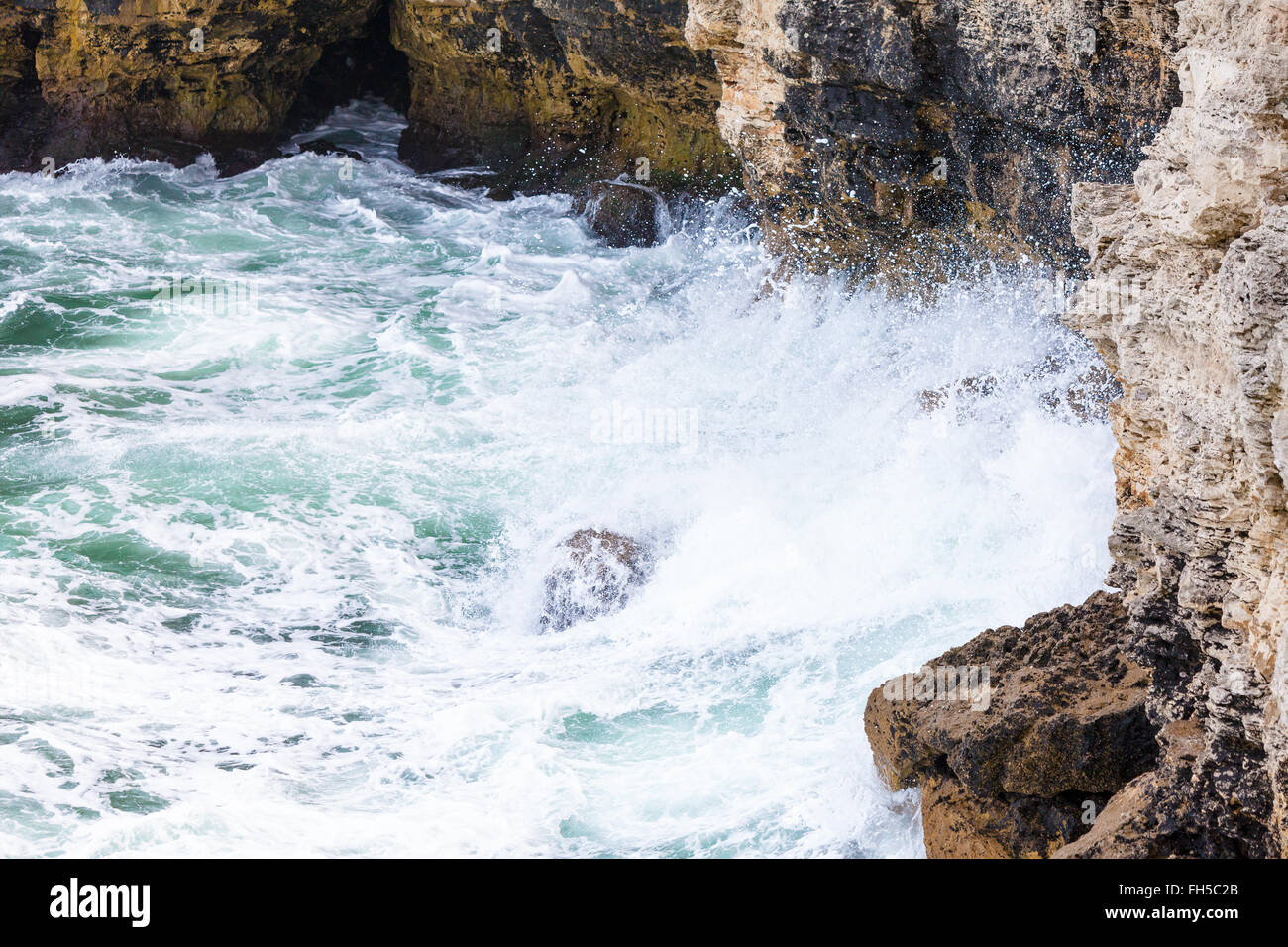 Wave Passing Between Two Rocks Rock and waves Stock Photo - Alamy