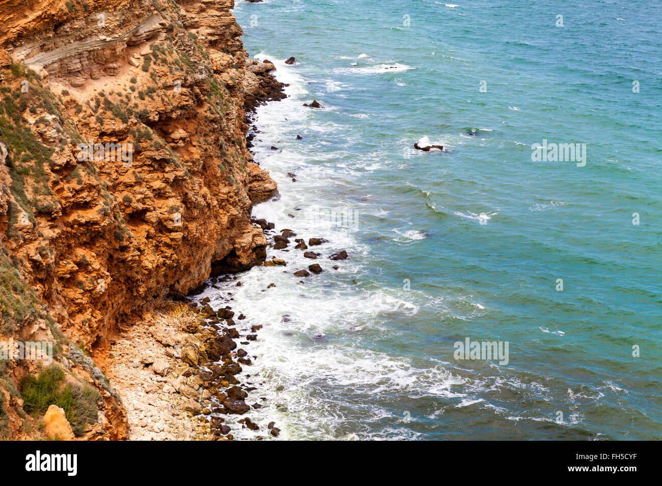 Rock and waves Stock Photo - Alamy
