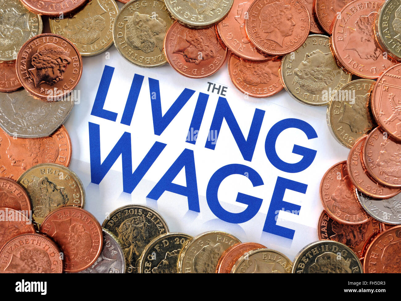 SUPERMARKET RECRUITMENT LEAFLET WITH COINS MONEY RE THE NATIONAL LIVING WAGE WAGES INCOMES WORKERS WELFARE PENSIONS JOB JOBS UK Stock Photo