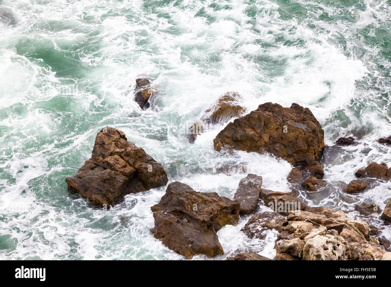 Rock and waves Stock Photo - Alamy