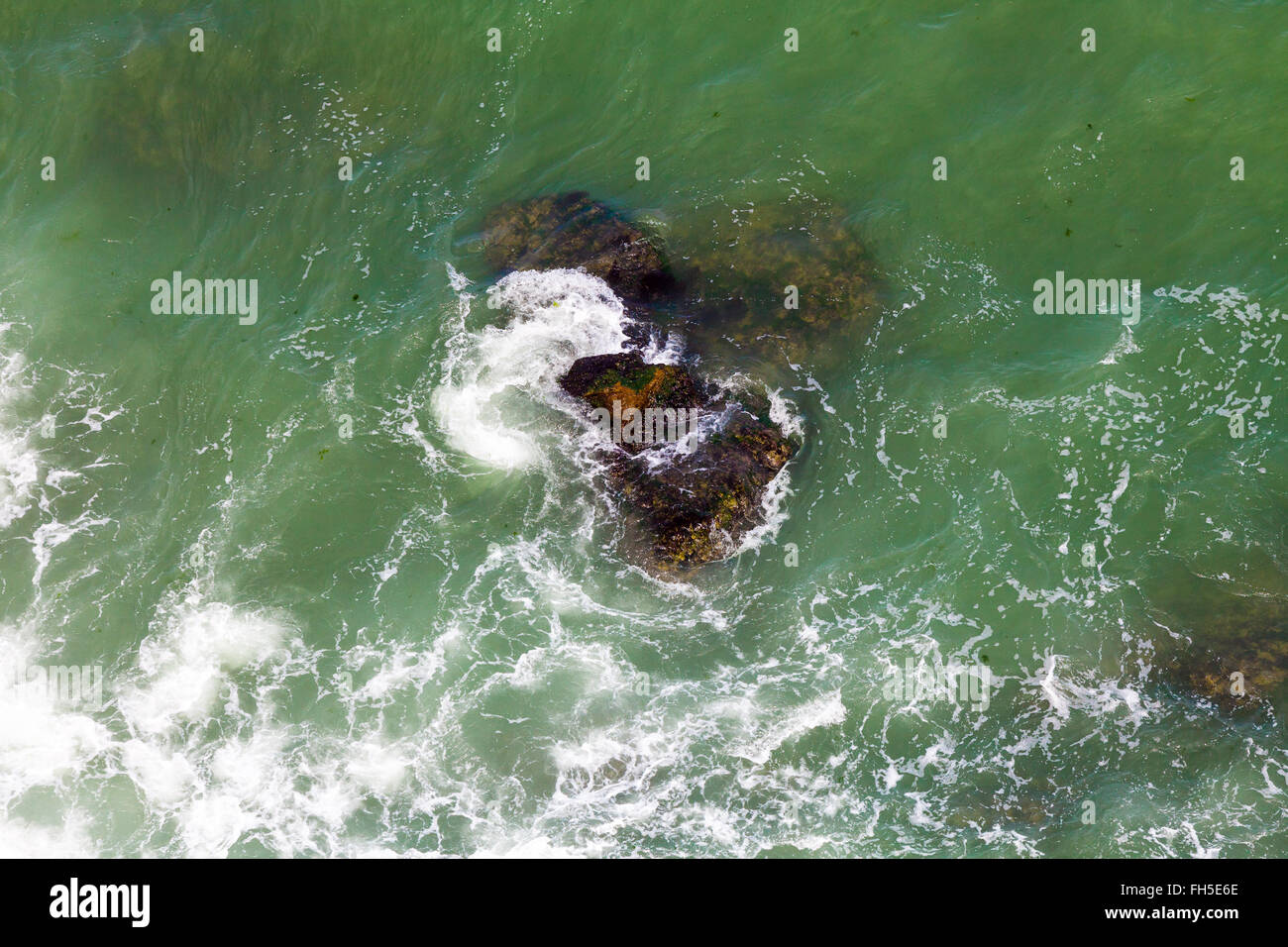 Rock and waves Stock Photo - Alamy