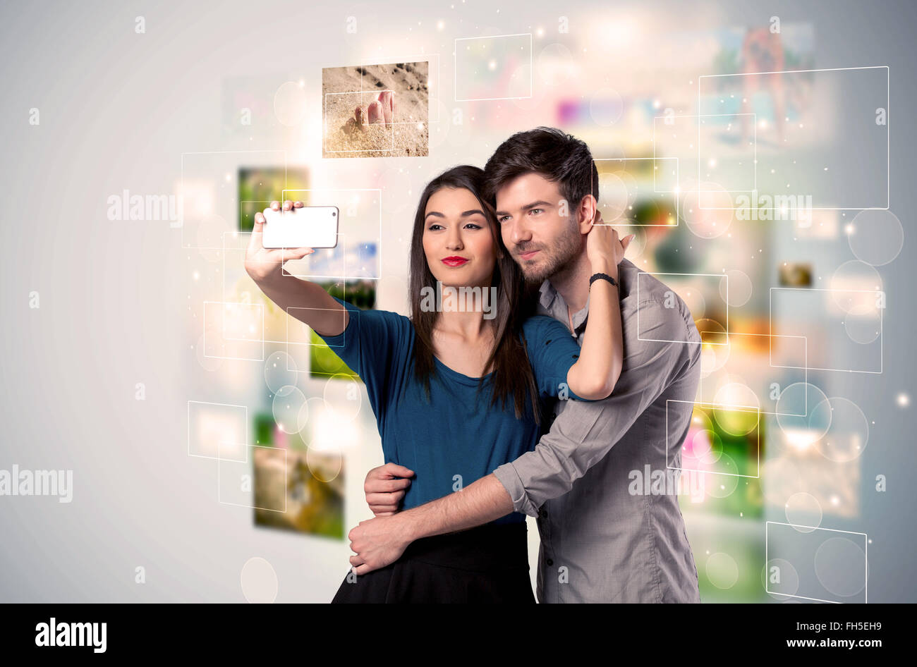 Happy young couple taking selfie pictures Stock Photo - Alamy