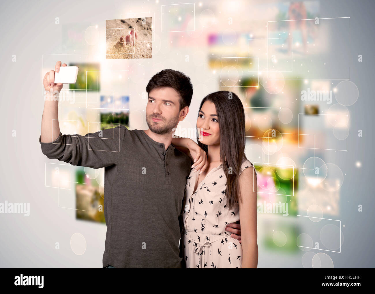 Happy young couple taking selfie pictures Stock Photo - Alamy
