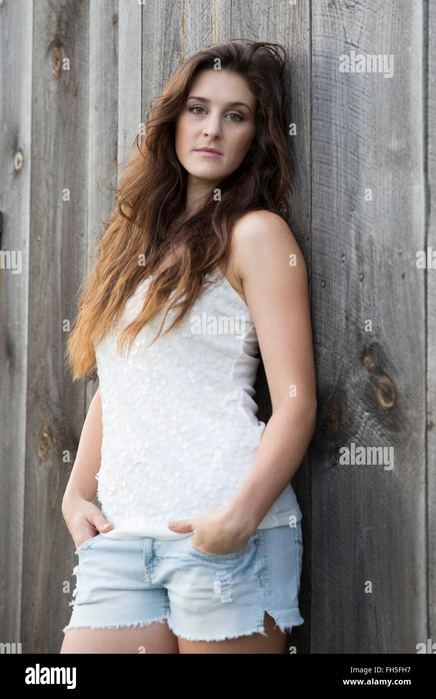 Beautiful brunette leaning on hi-res stock photography and images - Alamy