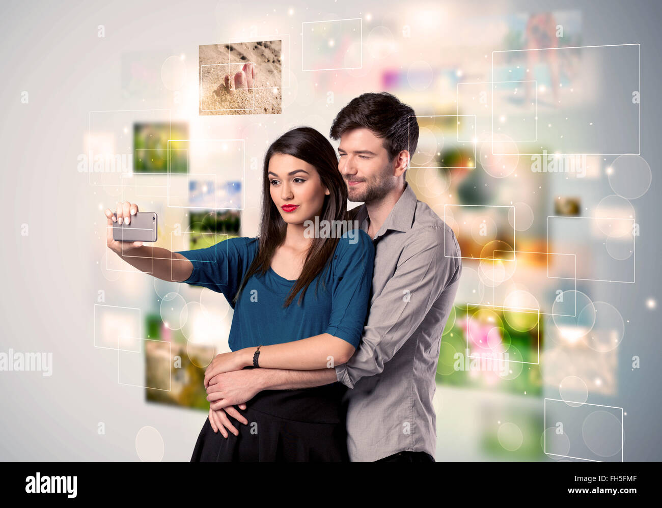 Happy young couple taking selfie pictures Stock Photo - Alamy