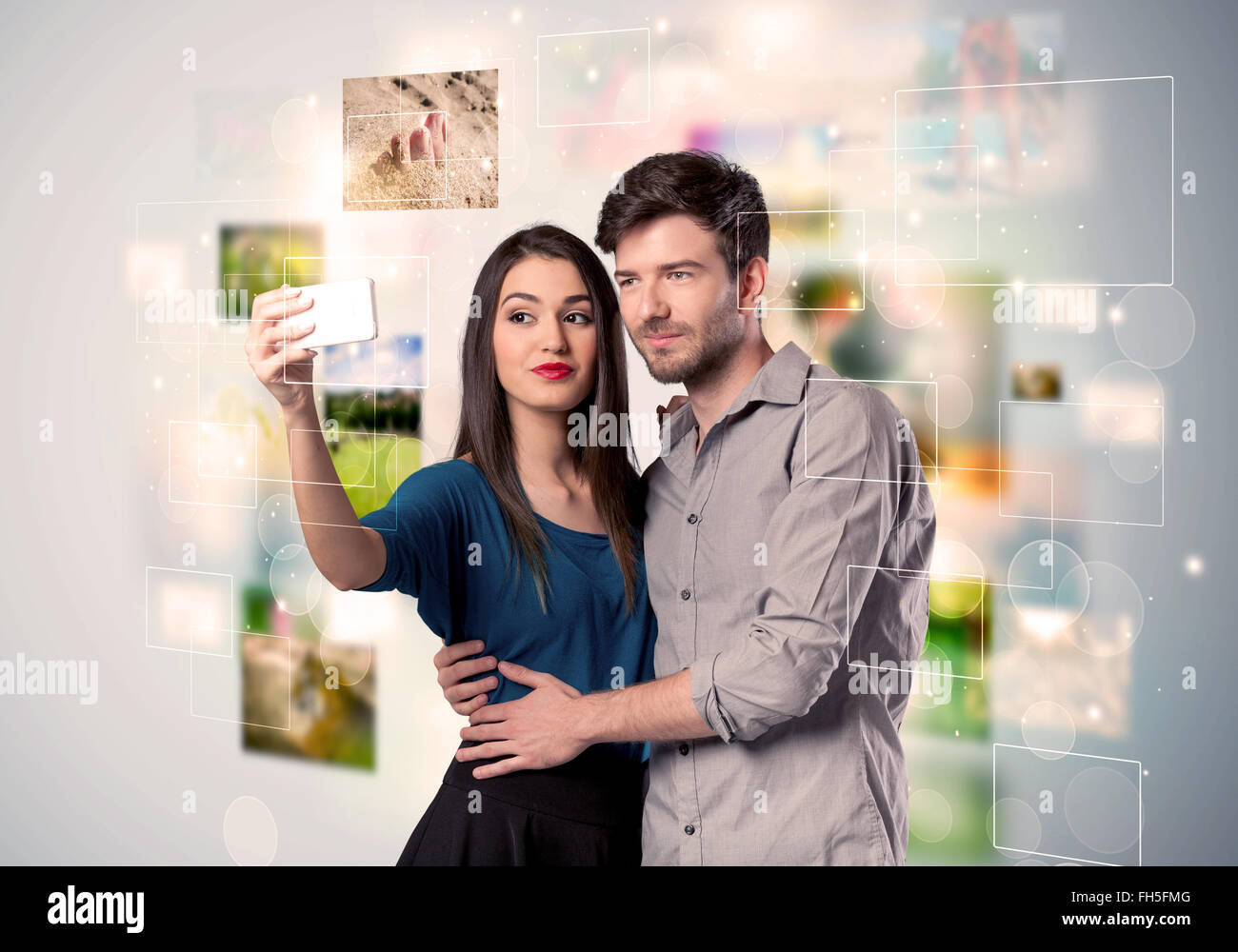 Happy young couple taking selfie pictures Stock Photo - Alamy