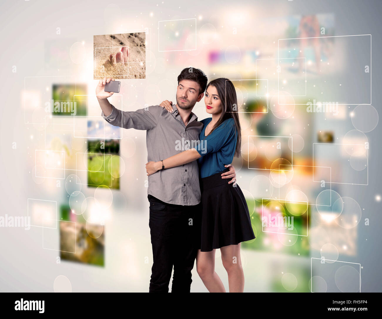 Happy young couple taking selfie pictures Stock Photo - Alamy