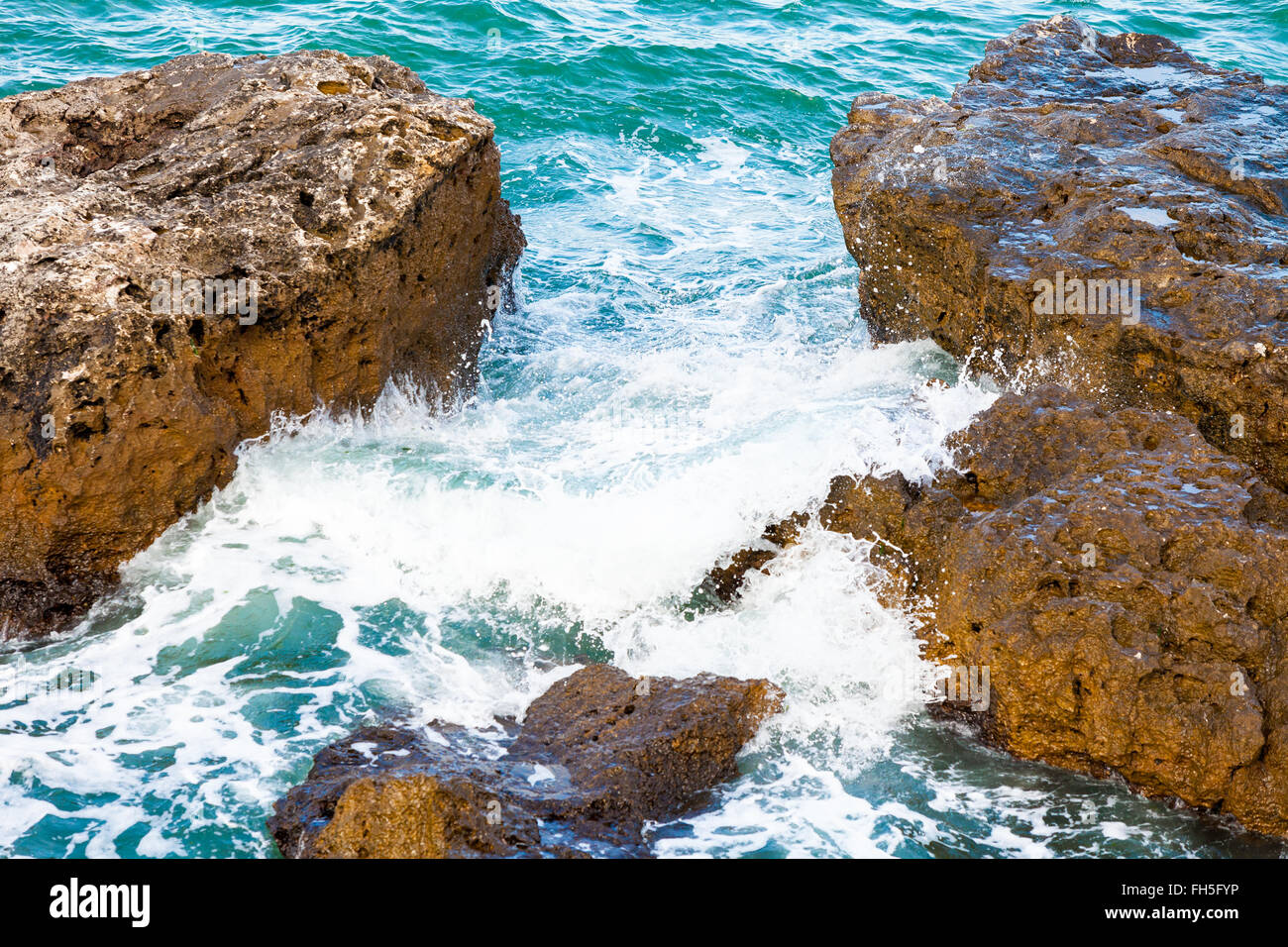 Rock and waves Stock Photo - Alamy