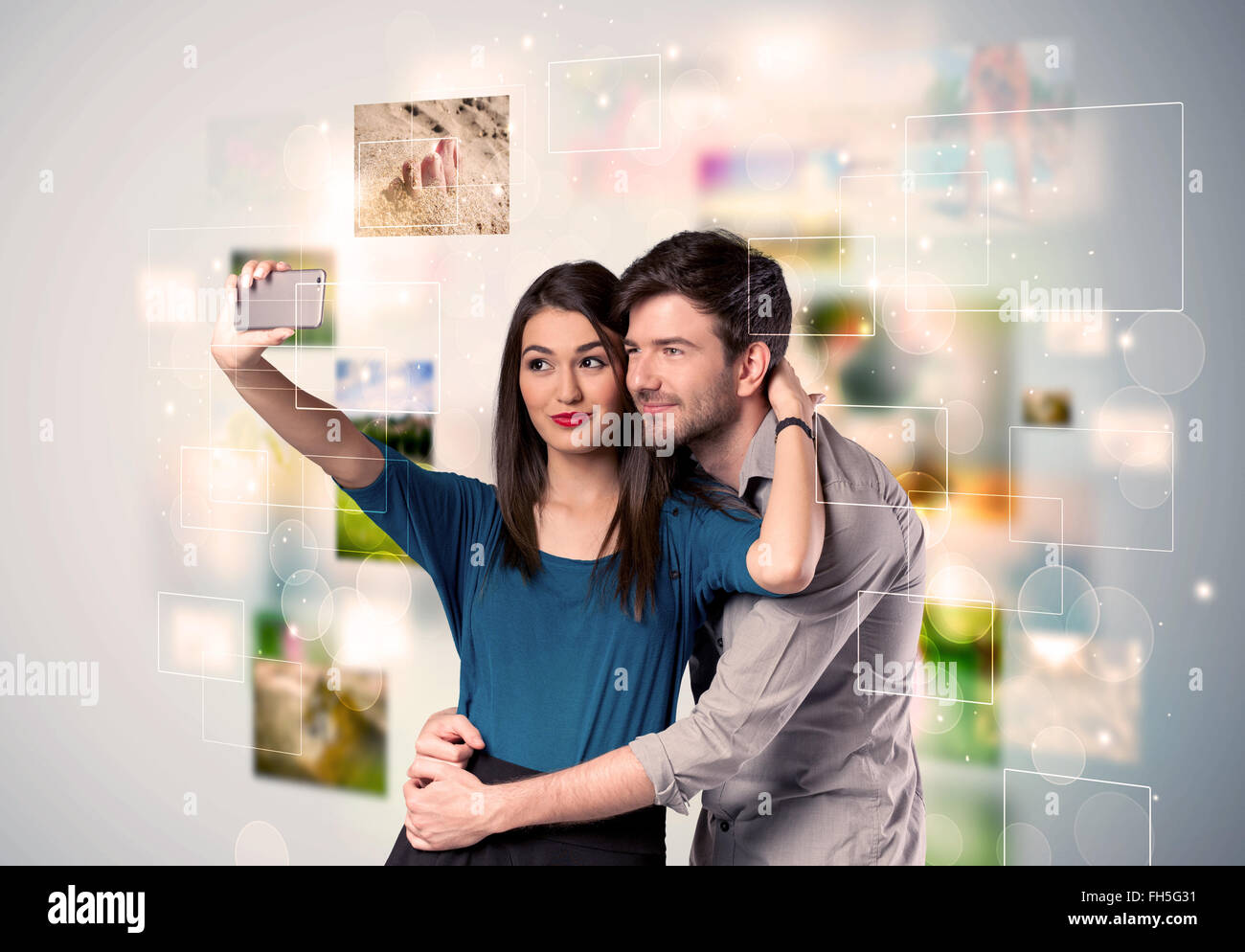 Happy young couple taking selfie pictures Stock Photo - Alamy
