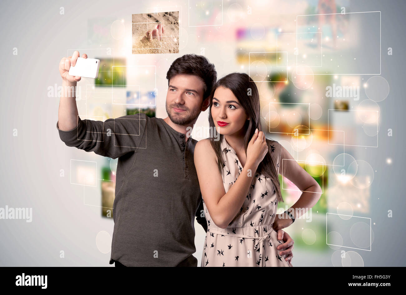 Happy young couple taking selfie pictures Stock Photo - Alamy