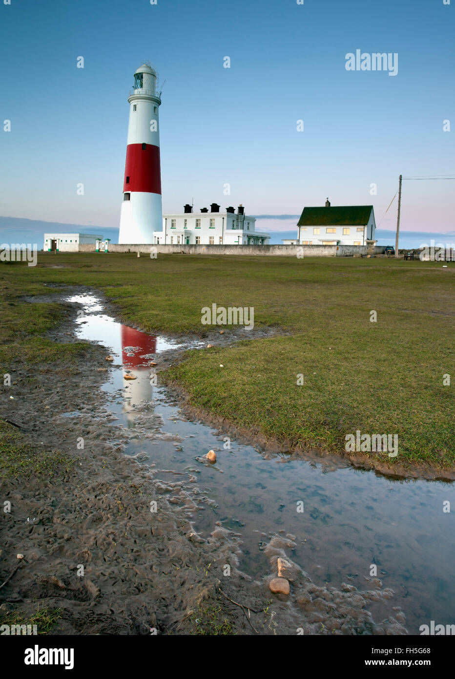 Portland lighthouse in Dorset UK reflected in a puddle taken on a Canon  5D mk11 Stock Photo