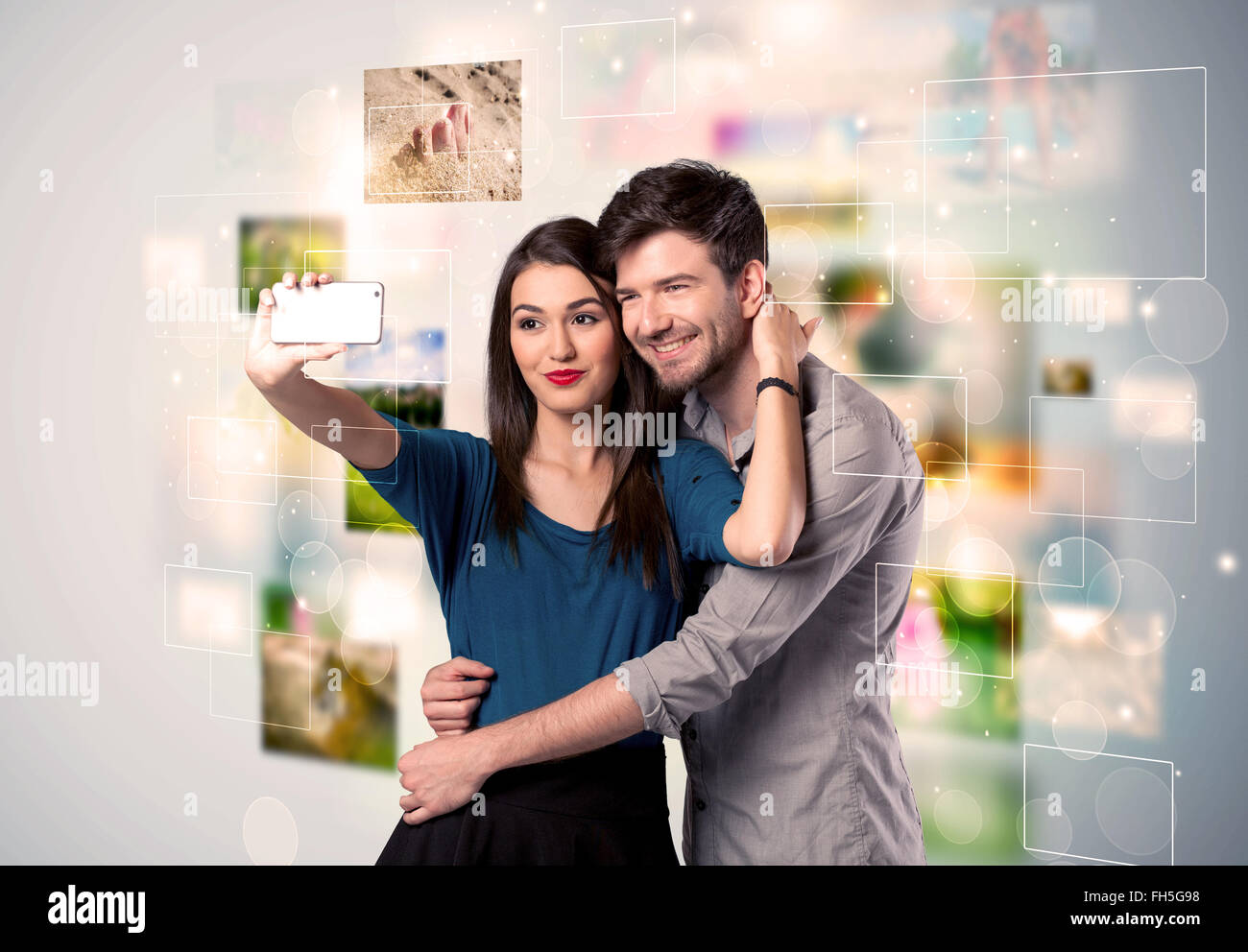 Happy young couple taking selfie pictures Stock Photo - Alamy