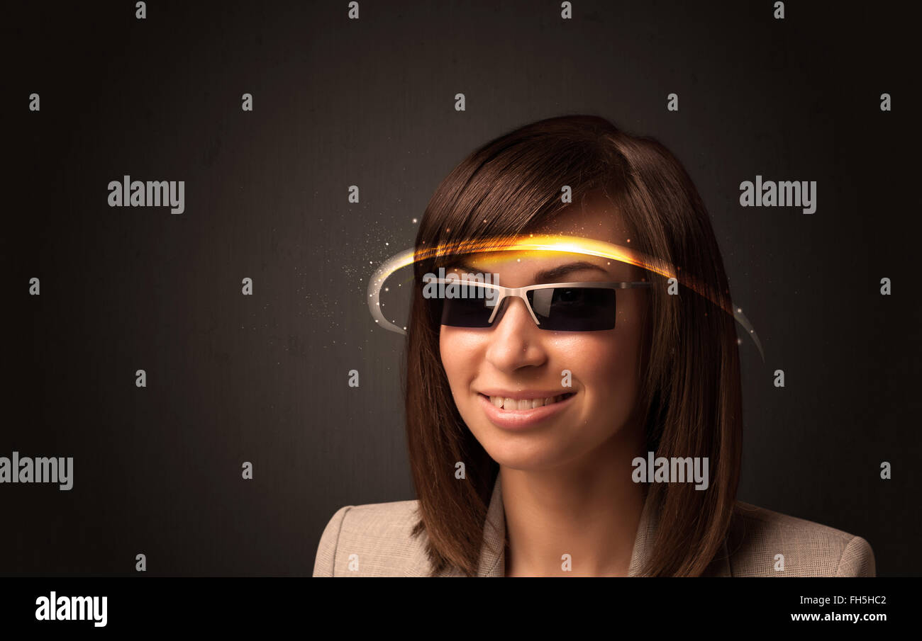 Pretty woman looking with futuristic high tech glasses Stock Photo