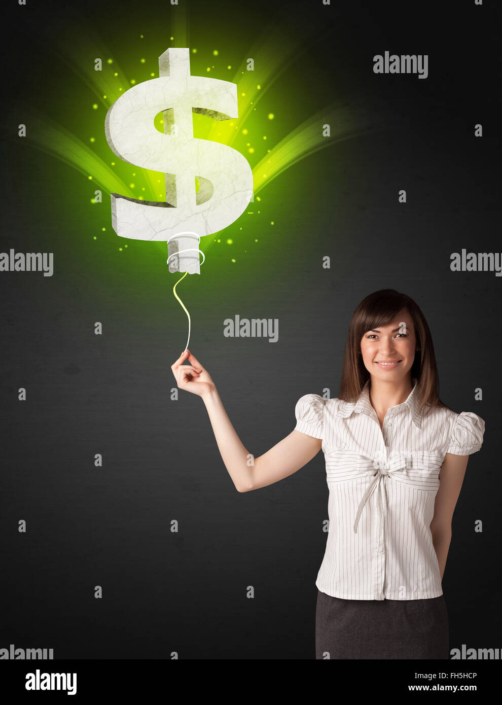 Businesswoman with a dollar sign balloon Stock Photo - Alamy