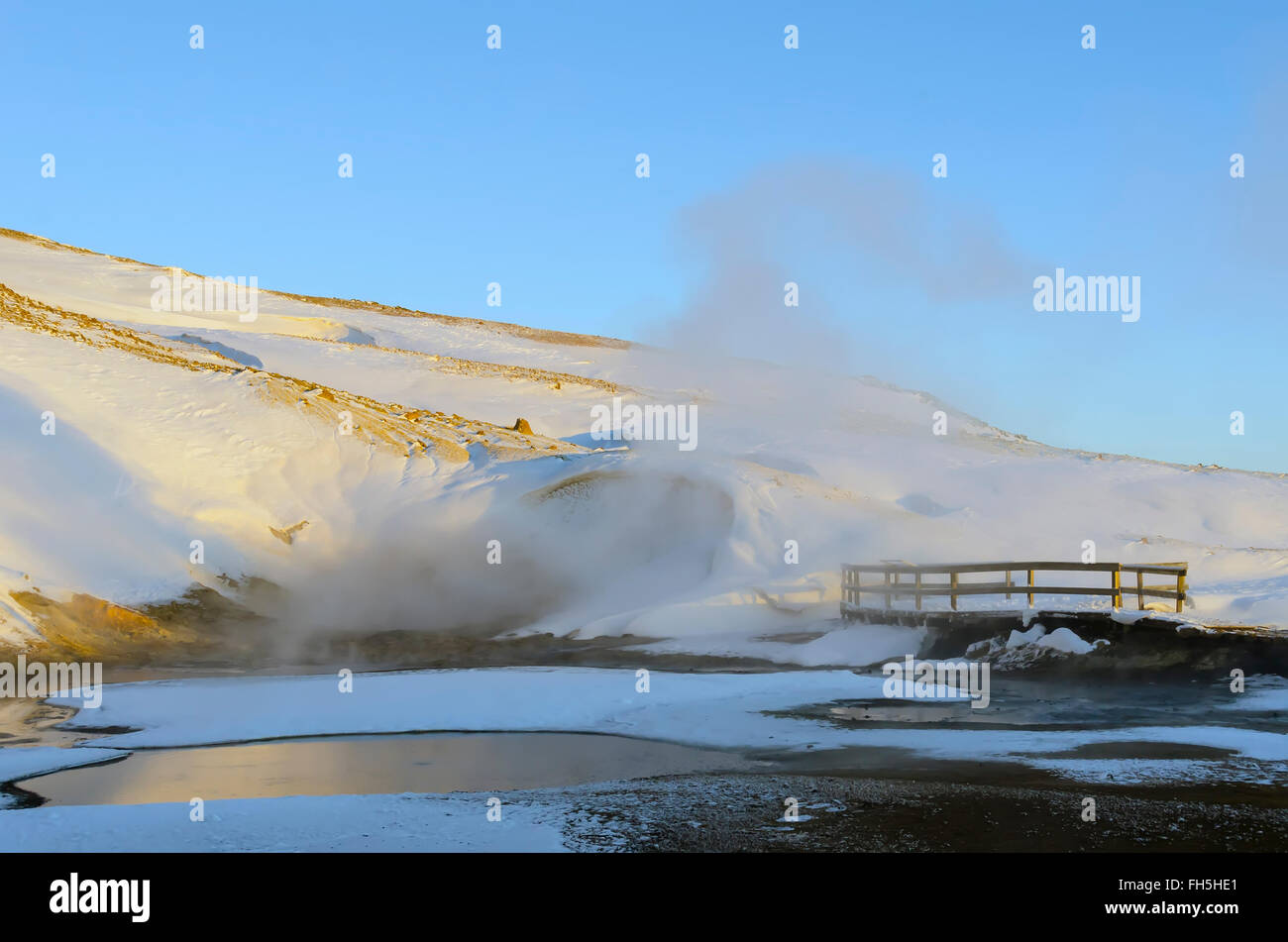 winter Krýsuvík geothermal area boiling hot spring steam, smoke boardwalk Reykjanes Peninsula Iceland Stock Photo