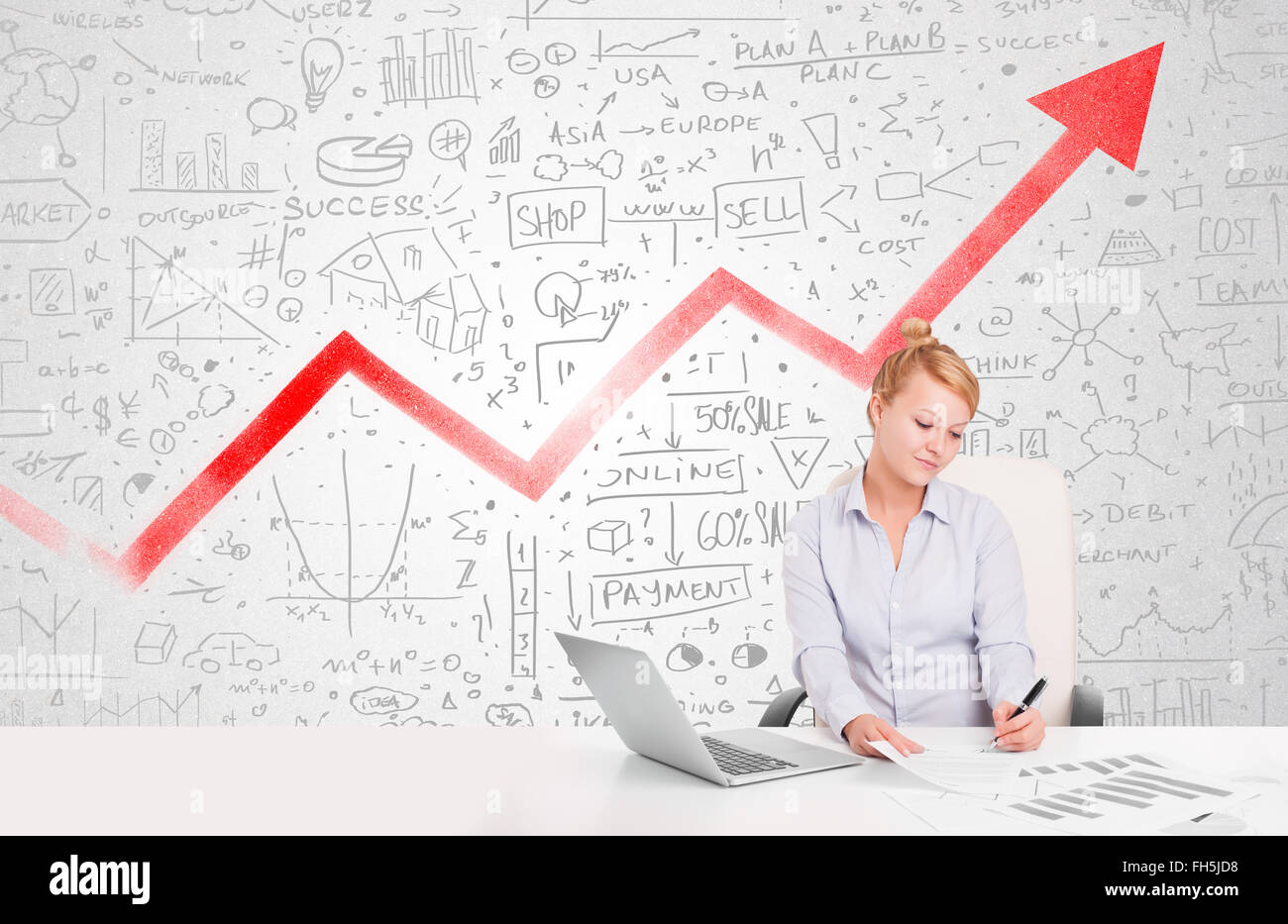 Business woman sitting at table with market diagrams Stock Photo - Alamy