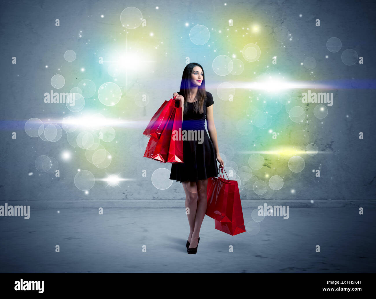 Mall lady with shopping bags and glitter light Stock Photo Alamy