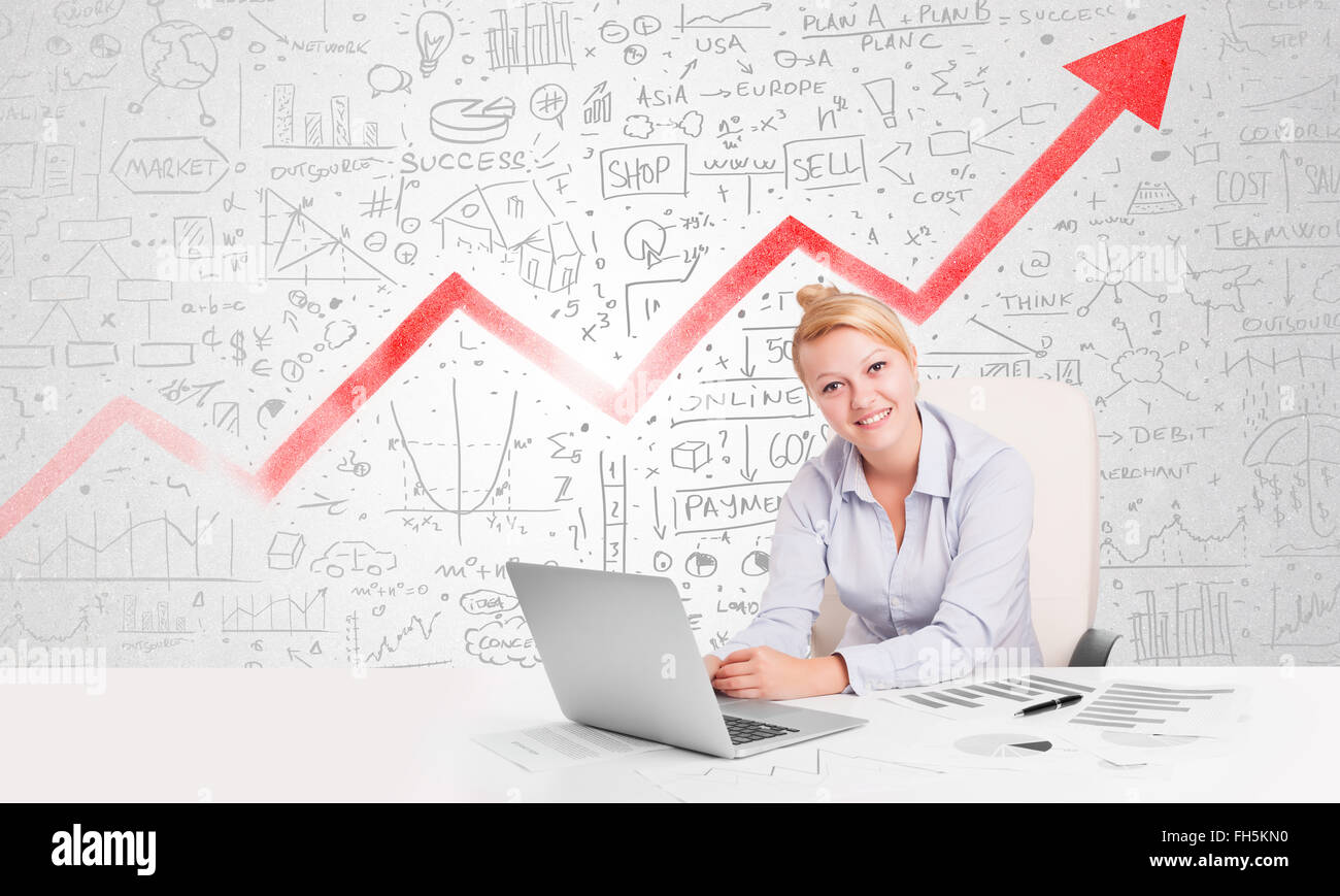 Business woman sitting at table with market diagrams Stock Photo - Alamy