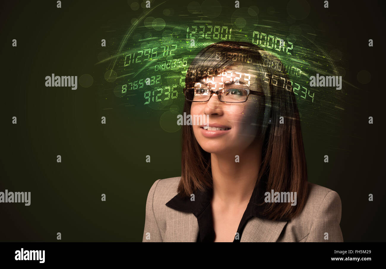 Business woman looking at high tech number calculations Stock Photo - Alamy