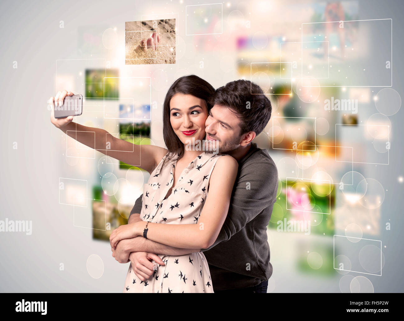 Happy young couple taking selfie pictures Stock Photo - Alamy