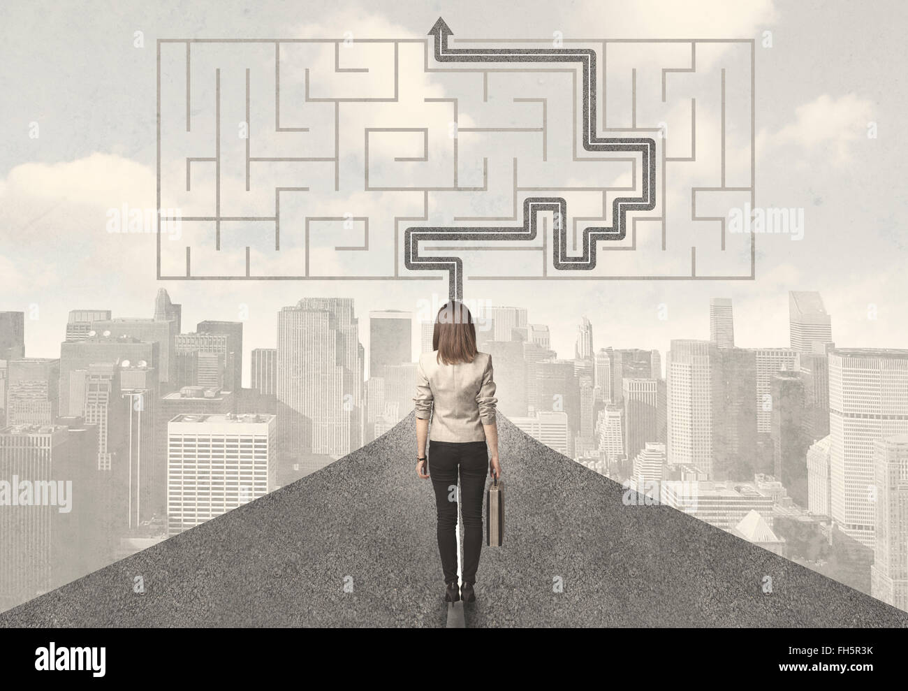 Business woman looking at road with maze and solution Stock Photo - Alamy