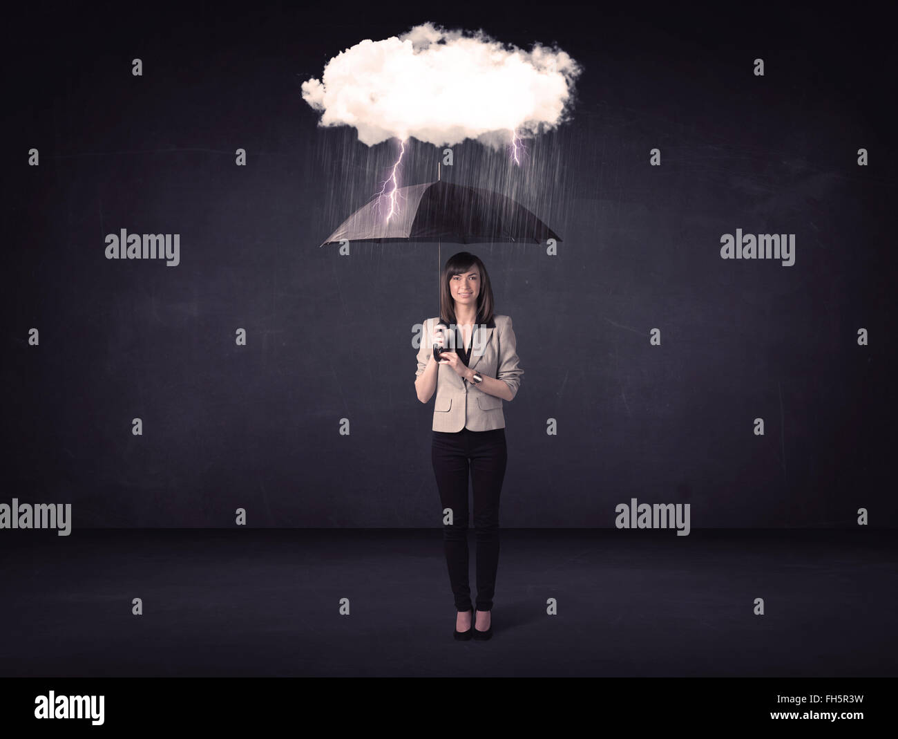 Businesswoman standing with umbrella and little storm cloud Stock Photo ...
