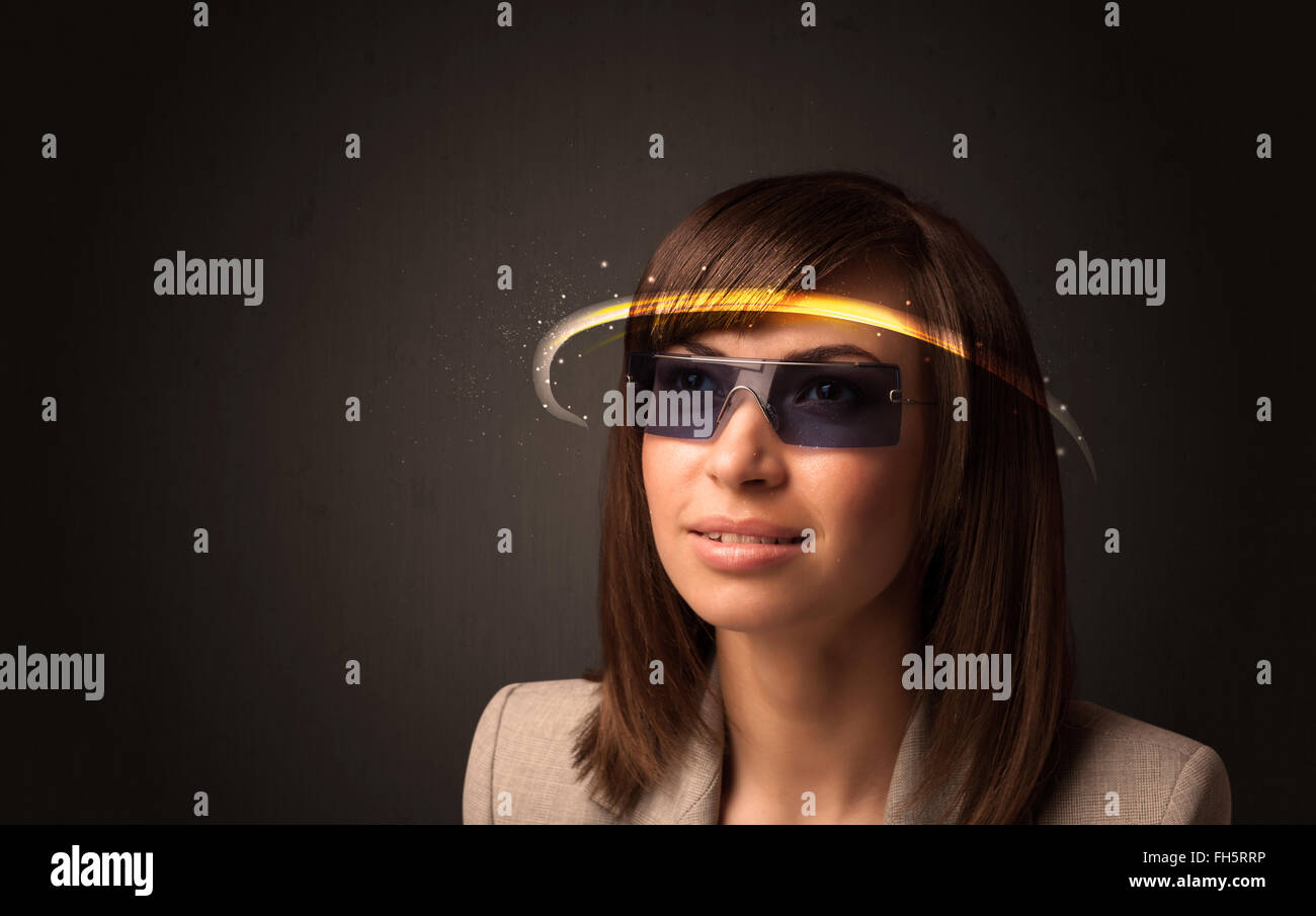 Pretty woman looking with futuristic high tech glasses Stock Photo
