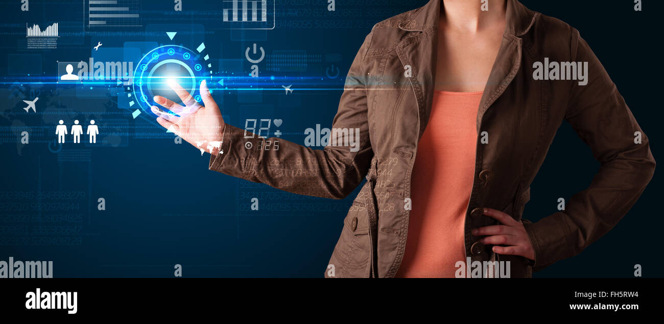 Young business woman touching future web technology buttons and icons ...
