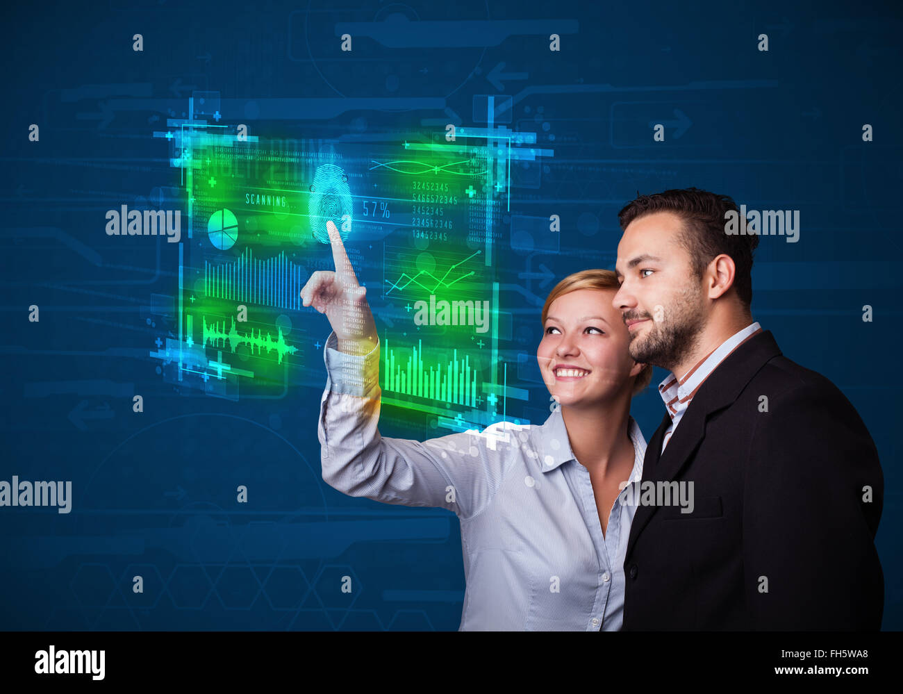 Young business couple pressing modern technology panel with finger print reader Stock Photo