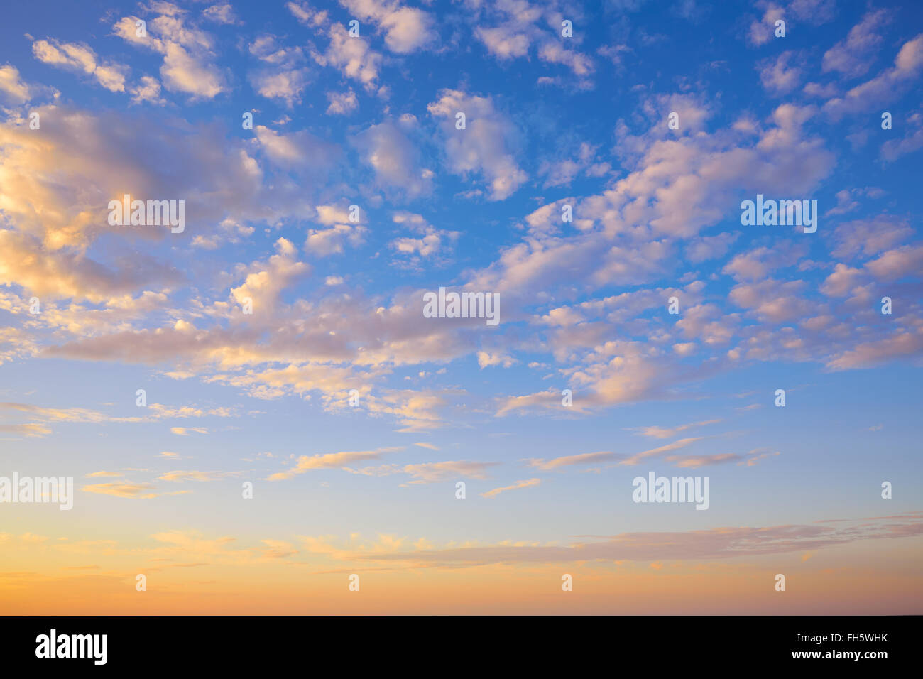 Sunset sky with golden and blue clouds in Mediterranean Stock Photo - Alamy