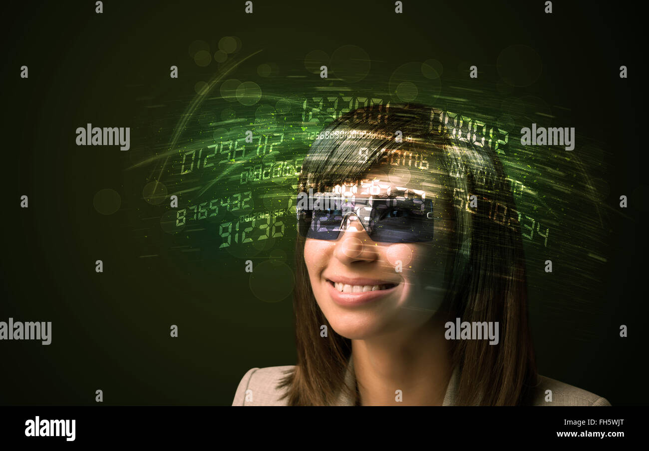 Business woman looking at high tech number calculations Stock Photo - Alamy