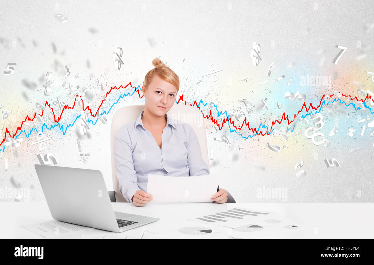 Business woman sitting at table with stock market graph Stock Photo - Alamy