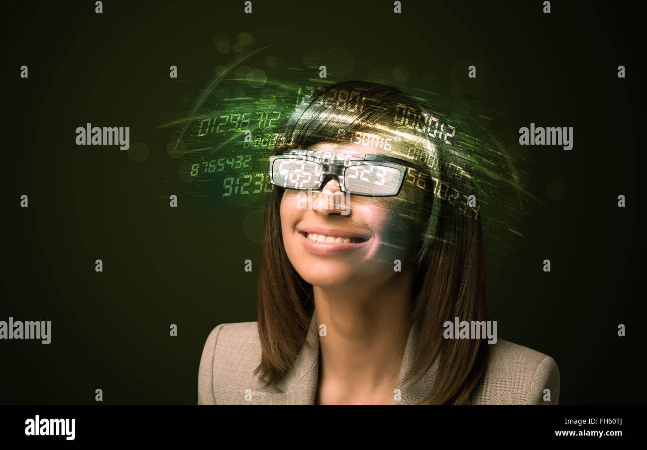 Business woman looking at high tech number calculations Stock Photo - Alamy