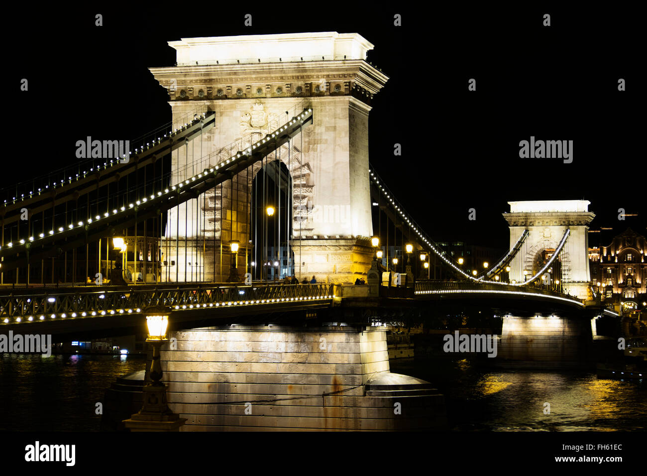 Arches of Szechenyi Chain Bridge Illuminated at Night, Budapest, Hungary Stock Photo