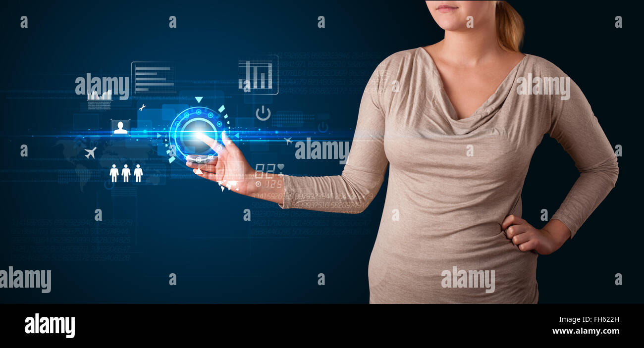 Young business woman touching future web technology buttons and icons ...
