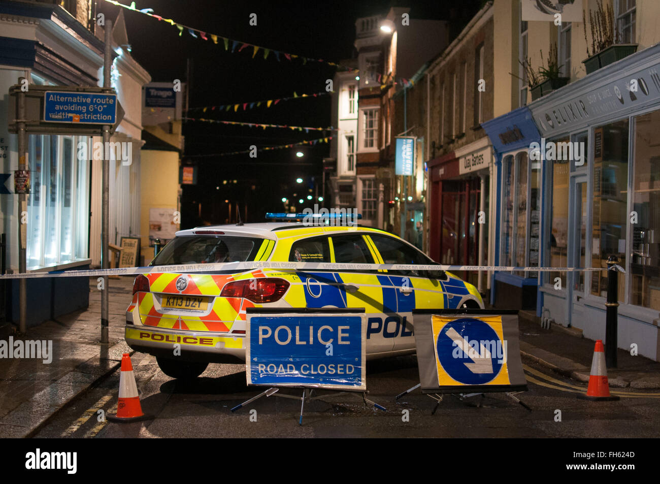 The police cordoned off Falmouth Highstreet due to unsafe conditions caused by a burst water pipe. Stock Photo