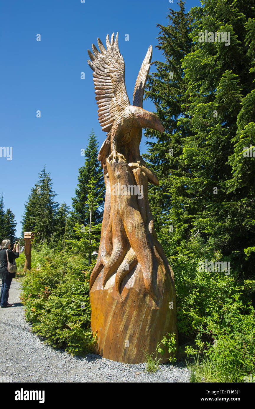 Log wood carvings, Grouse Mountain, British Columbia Stock Photo Alamy