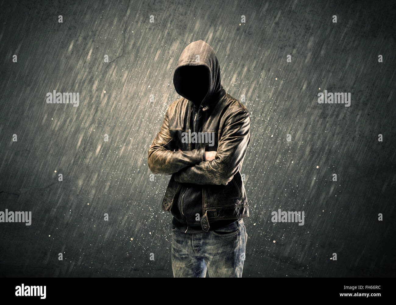 Spooky faceless guy standing in hoodie Stock Photo