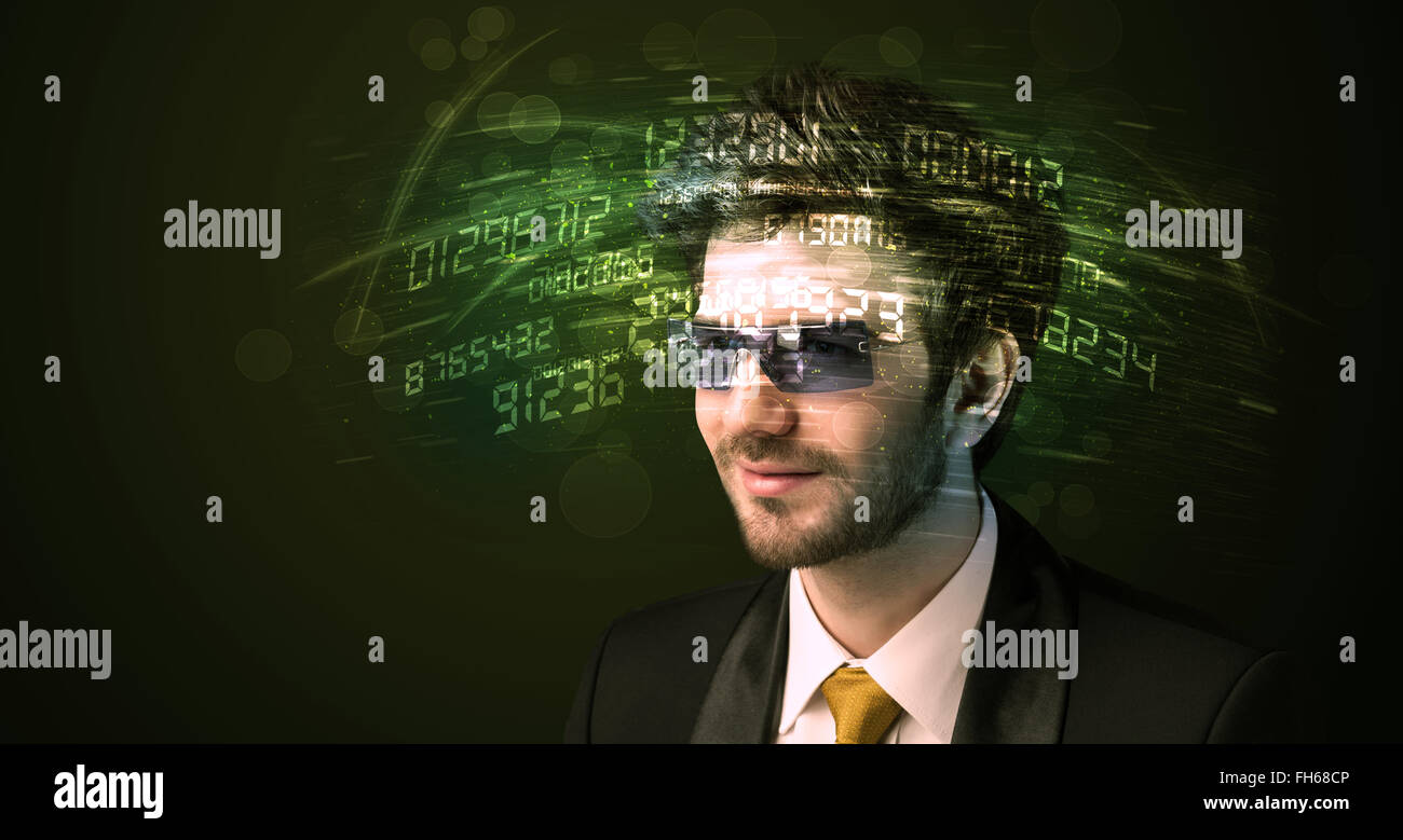 Business man looking at high tech number calculations Stock Photo - Alamy