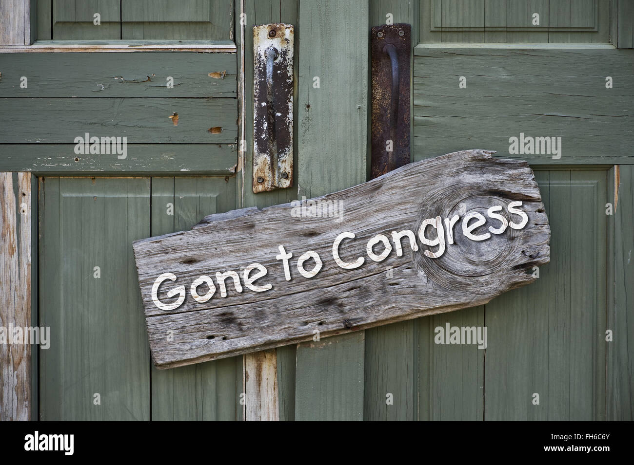 Old gone to congress sign on green doors. Stock Photo