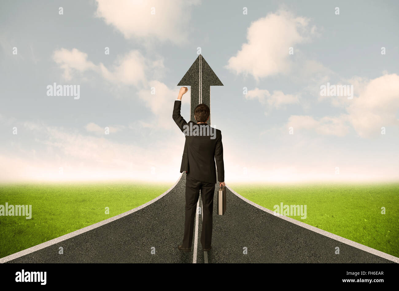 Businessman lokking at 3d road upgoing arrow Stock Photo