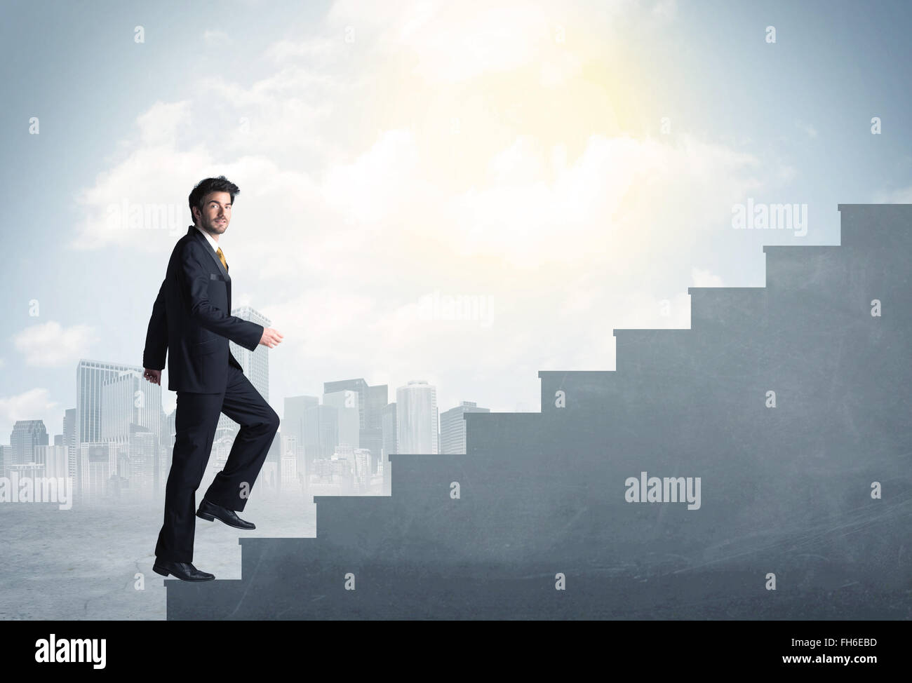 Businessman climbing up a concrete staircase concept Stock Photo - Alamy