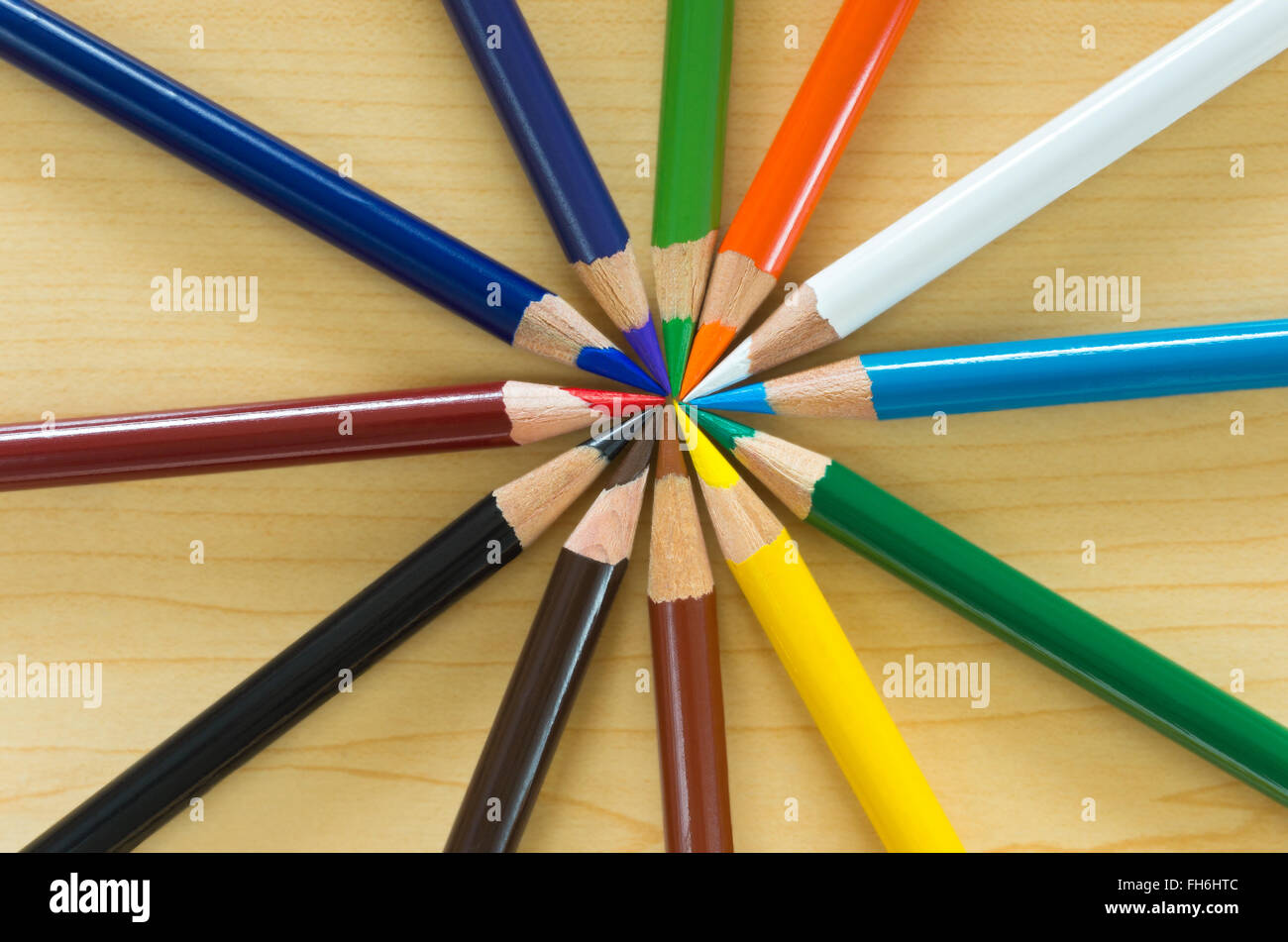 studio still life abstract of art pencils in circle or radial pattern Stock Photo