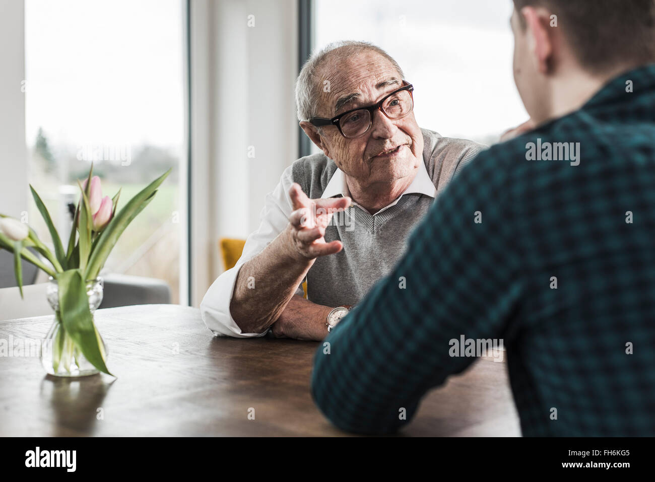 Portrait of senior man communicating with his grandson Stock Photo