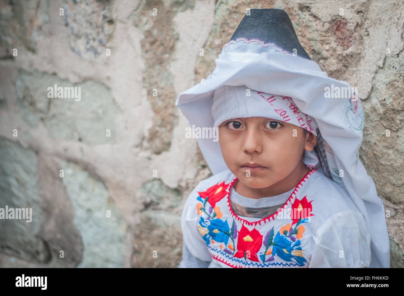 A little girl in the mondays of the hill in the Guelaguetza celebration in Oaxaca, Mexico Stock Photo